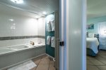master suite bathroom, jetted tub and shower, bathroom linens, master bedroom, 